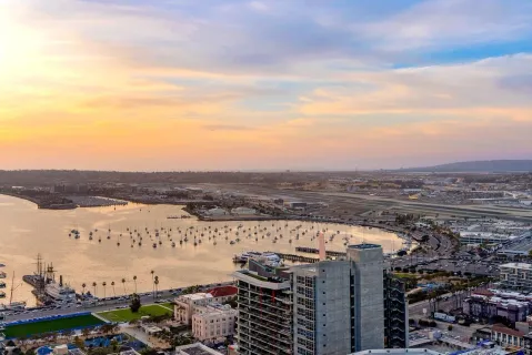 a view of a city and ocean