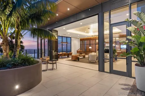 a lobby with furniture and floor to ceiling window