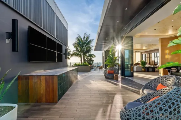 a bedroom with a bed and a night stand