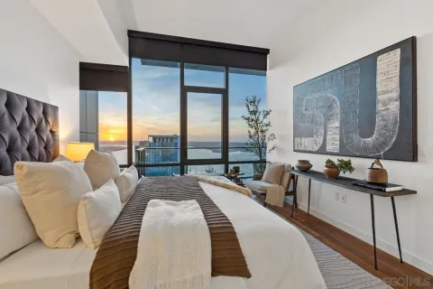 a view of roof deck with two chairs and a potted plant