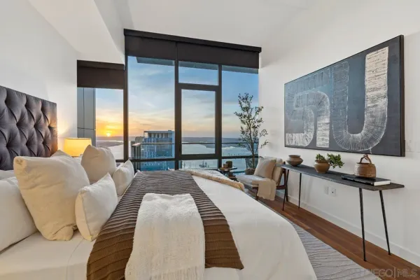 a view of roof deck with two chairs and a potted plant