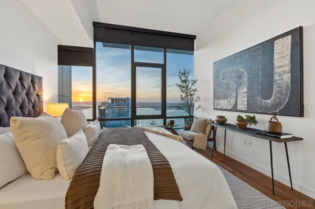 a view of roof deck with two chairs and a potted plant