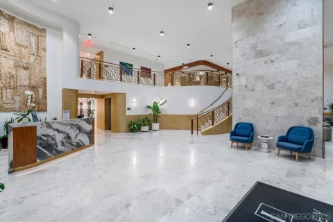 a view of a swimming pool with lounge chairs in patio