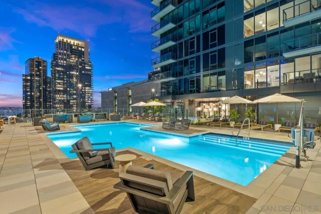 a view of a dining room and hall with kitchen view