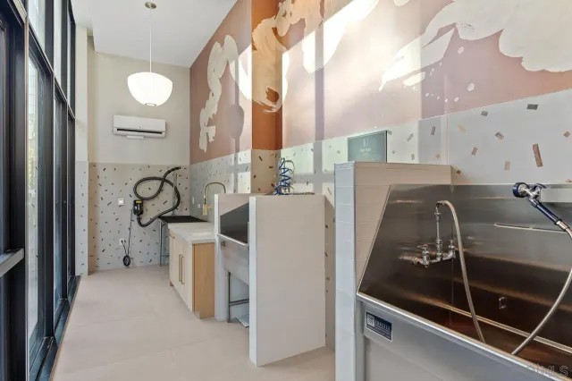 a view of a patio with couches and potted plants