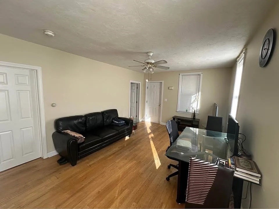 150 Sumner Street, Unit 1 Quincy, MA 02169 - Photo 8 of 10 a living room with furniture and wooden floor