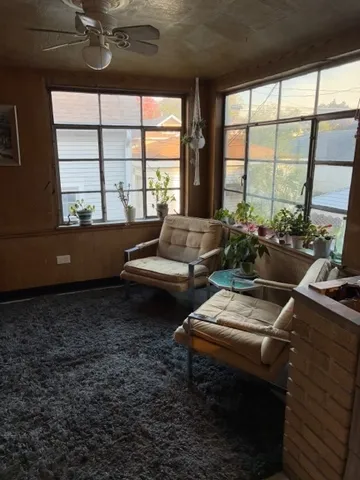 a room with furniture and a large window