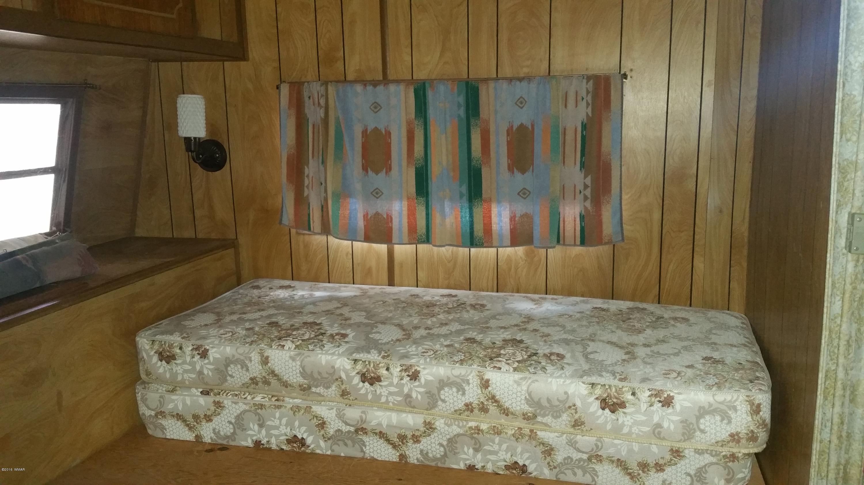 5139 Garibaldi Road Snowflake, AZ 85937 - Photo 26 of 39 a bedroom with a bed and a window