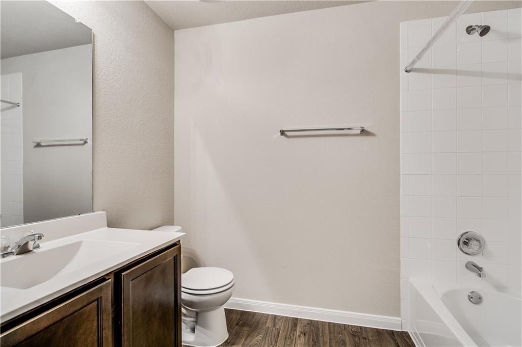 185 Voss Kyle, TX 78640 - Photo 20 of 26 a bathroom with a sink a toilet and shower