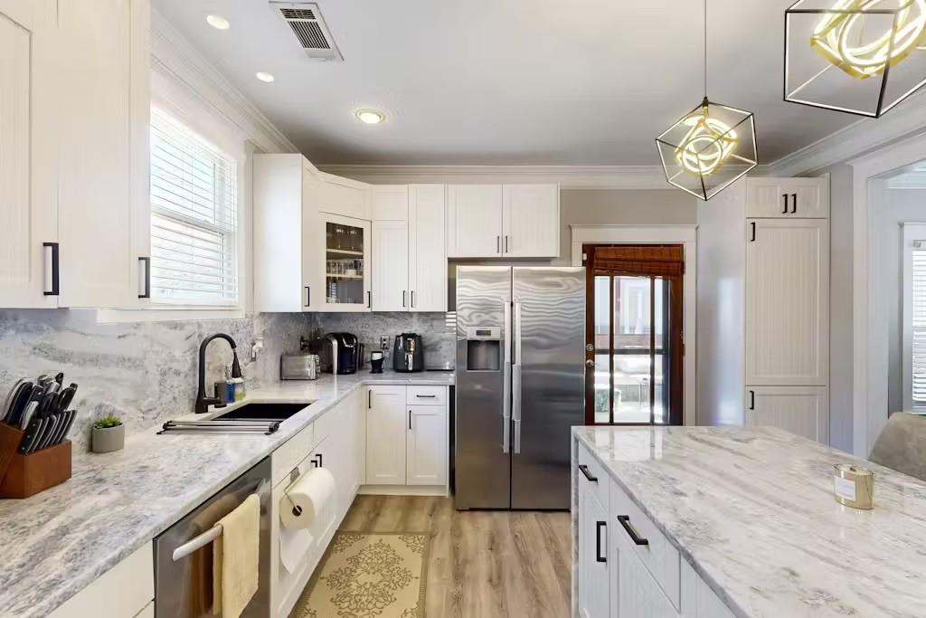 153 Randolph Street Northeast Atlanta, GA 30312 - Photo 11 of 37 a kitchen with refrigerator cabinets and a sink