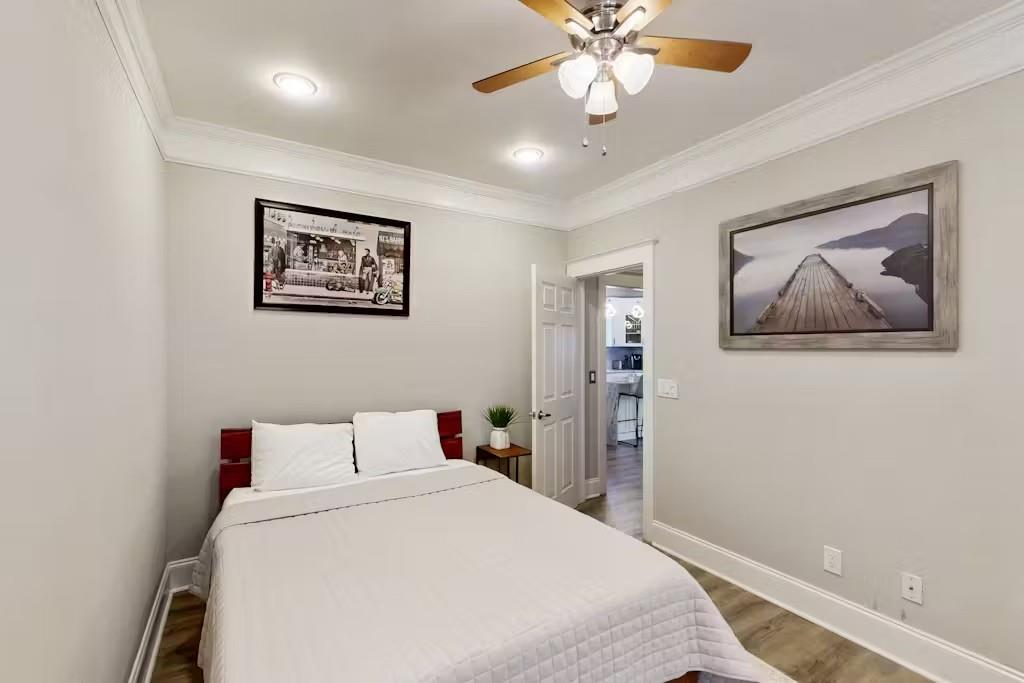 153 Randolph Street Northeast Atlanta, GA 30312 - Photo 14 of 37 a bedroom with a bed and a painting on the wall