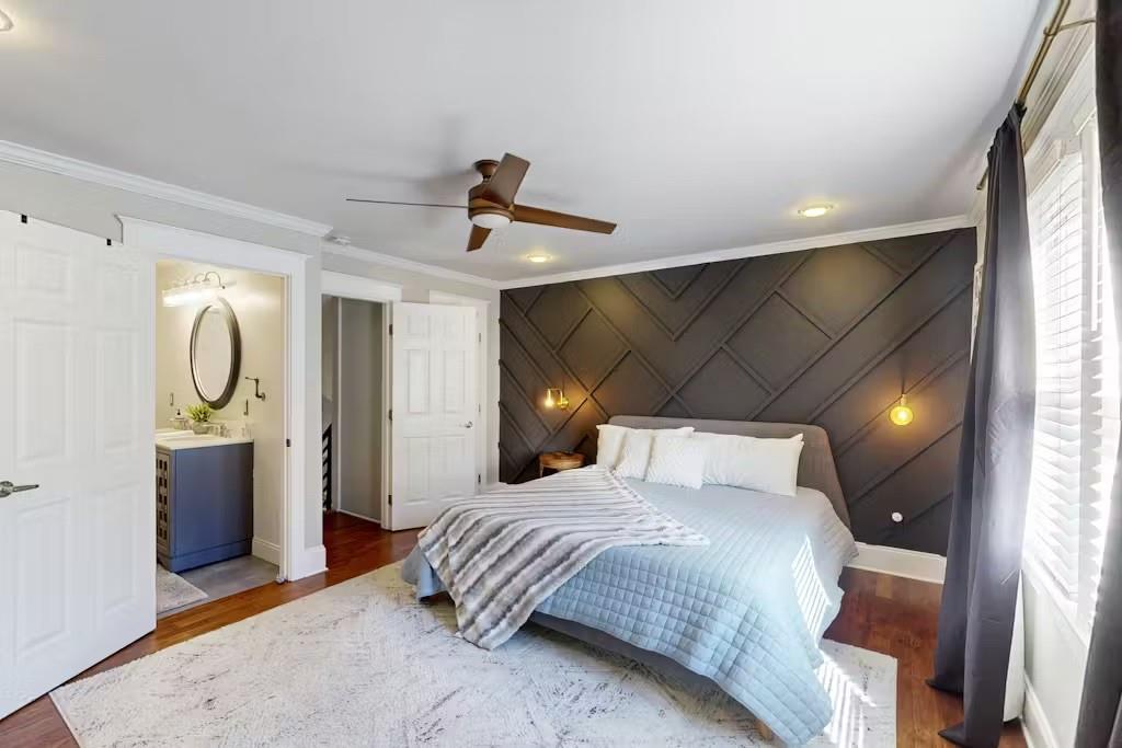 153 Randolph Street Northeast Atlanta, GA 30312 - Photo 18 of 37 a bedroom with a bed and a mirror