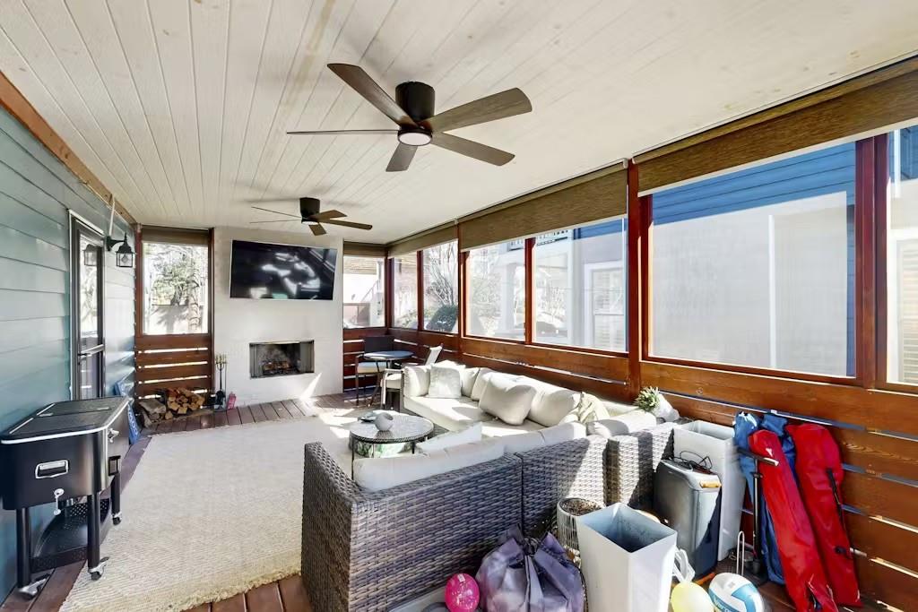 153 Randolph Street Northeast Atlanta, GA 30312 - Photo 23 of 37 a living room with furniture a fireplace and a flat screen tv