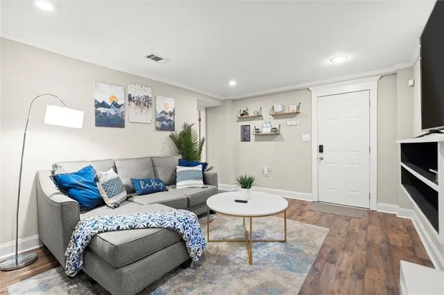 a kitchen with a stove sink and cabinets