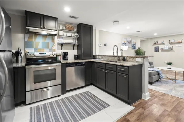 a spacious bedroom with a bed and a couch