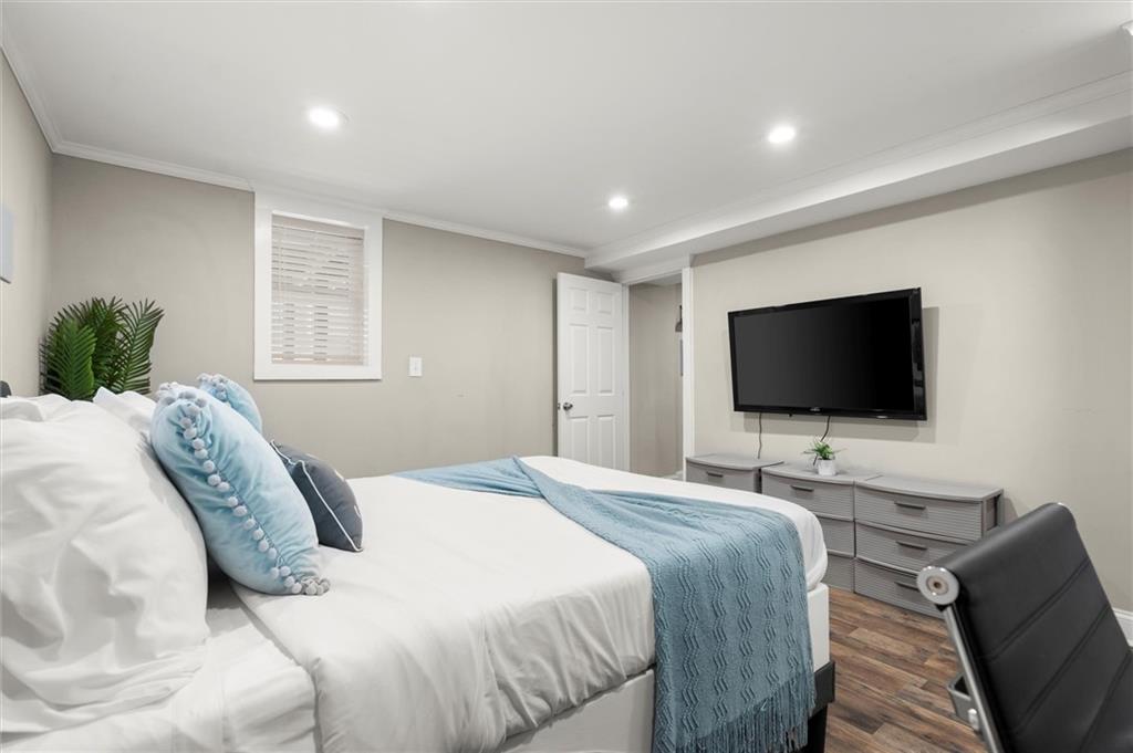 153 Randolph Street Northeast Atlanta, GA 30312 - Photo 30 of 37 a bedroom with a bed and a flat screen tv