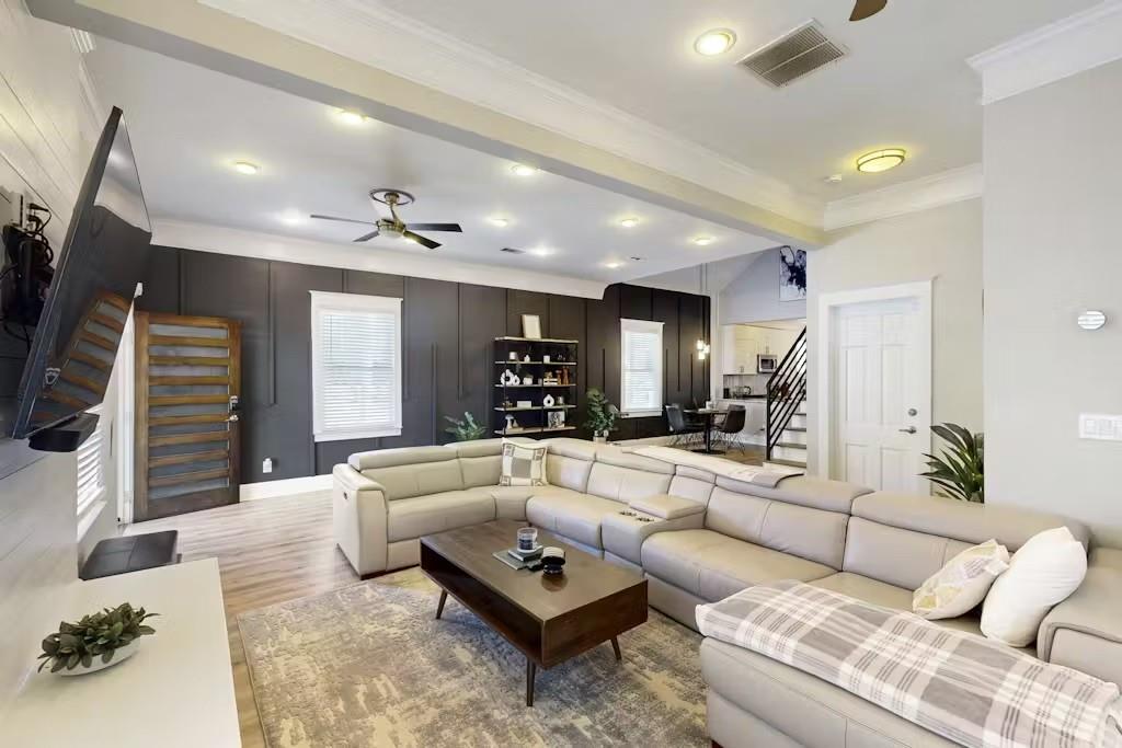 153 Randolph Street Northeast Atlanta, GA 30312 - Photo 3 of 37 a living room with furniture and a flat screen tv