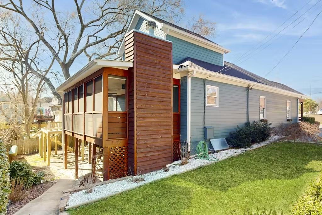 153 Randolph Street Northeast Atlanta, GA 30312 - Photo 37 of 37 a front view of a house with a yard and outdoor seating