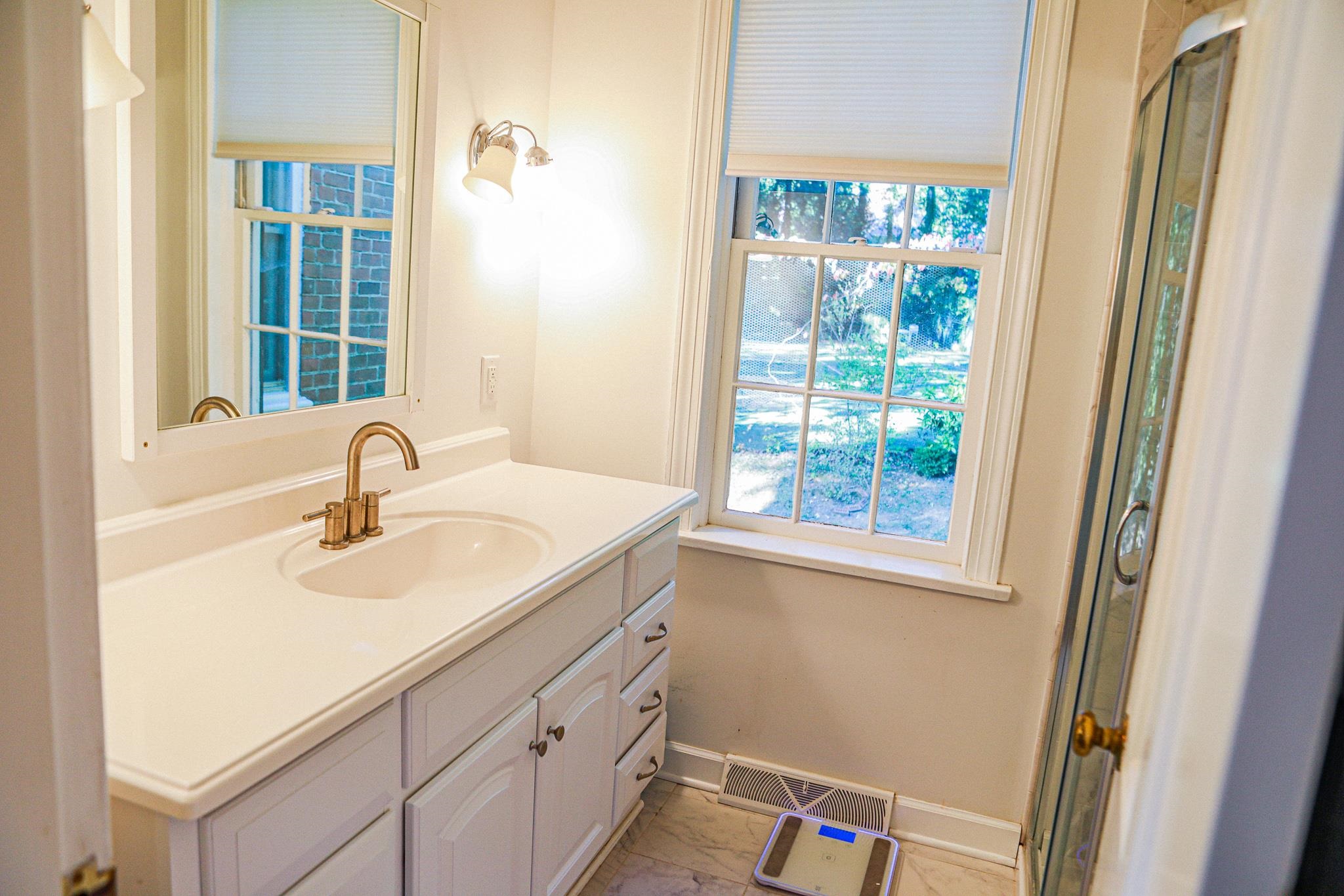 19 Ridgewood Drive Staunton, VA 24401 - Photo 60 of 73 a bathroom with a sink and a window
