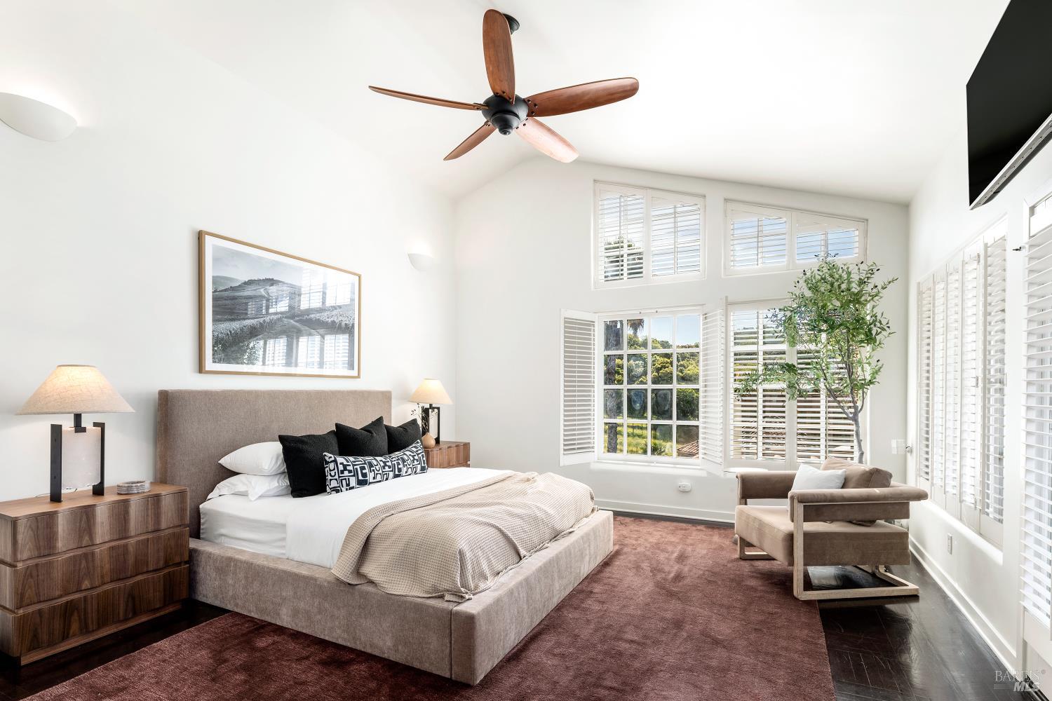4377 Warm Springs Road Glen Ellen, CA 95442 - Photo 19 of 56 a spacious bedroom with a bed a couch and a flat tv screen on dresser