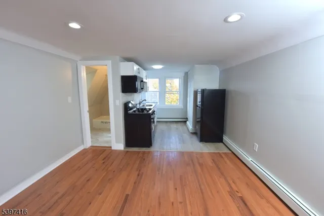 a view of kitchen and wooden floor