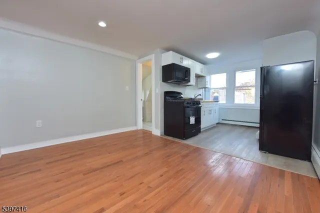a view of kitchen with microwave and stove