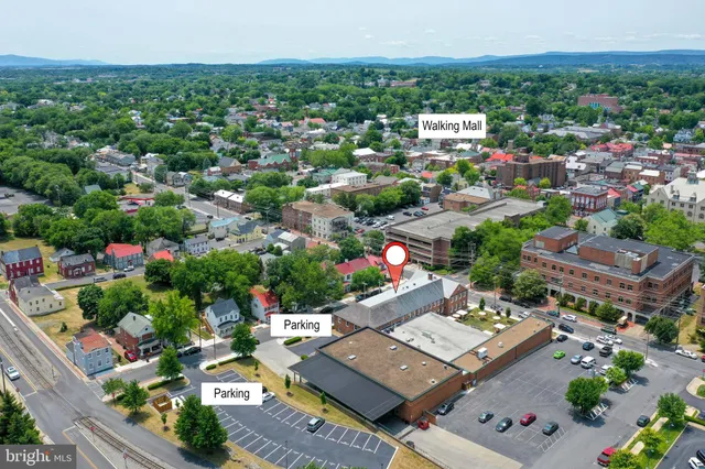 an aerial view of residential house with outdoor space and street view