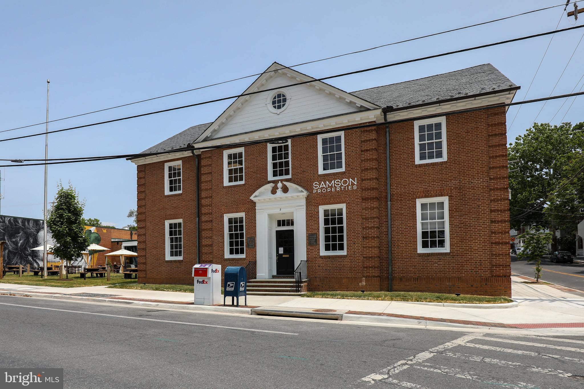 210 East Boscawen Street, Unit 203 Winchester, VA 22601 - Photo 23 of 27 a front view of a house with a yard