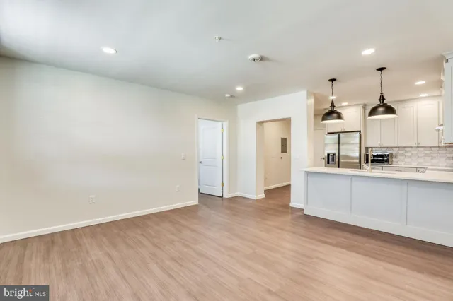 a view of kitchen with wooden floor