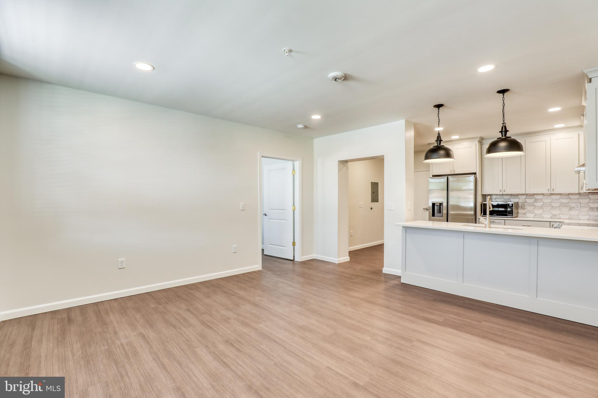 210 East Boscawen Street, Unit 203 Winchester, VA 22601 - Photo 7 of 27 a view of kitchen with wooden floor