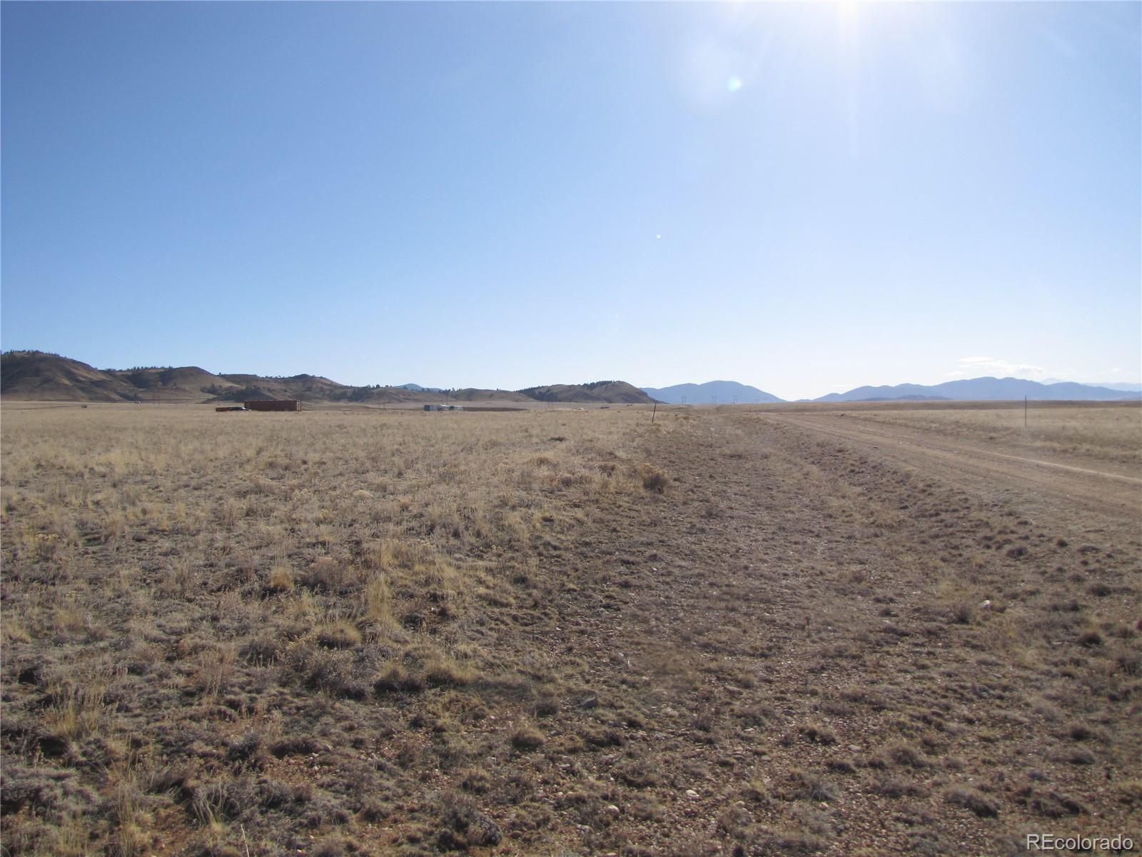 235 Routt Road Hartsel, CO 80449 - Photo 7 of 13 a view of a large mountain with mountains in the background