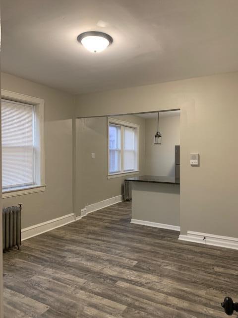 1923 Clark Street Whiting, IN 46394 - Photo 11 of 16 an empty room with wooden floor and windows