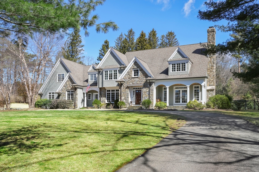 1 Myles Standish Road Weston, MA 02493 - Photo 1 of 40 a front view of a house with a yard