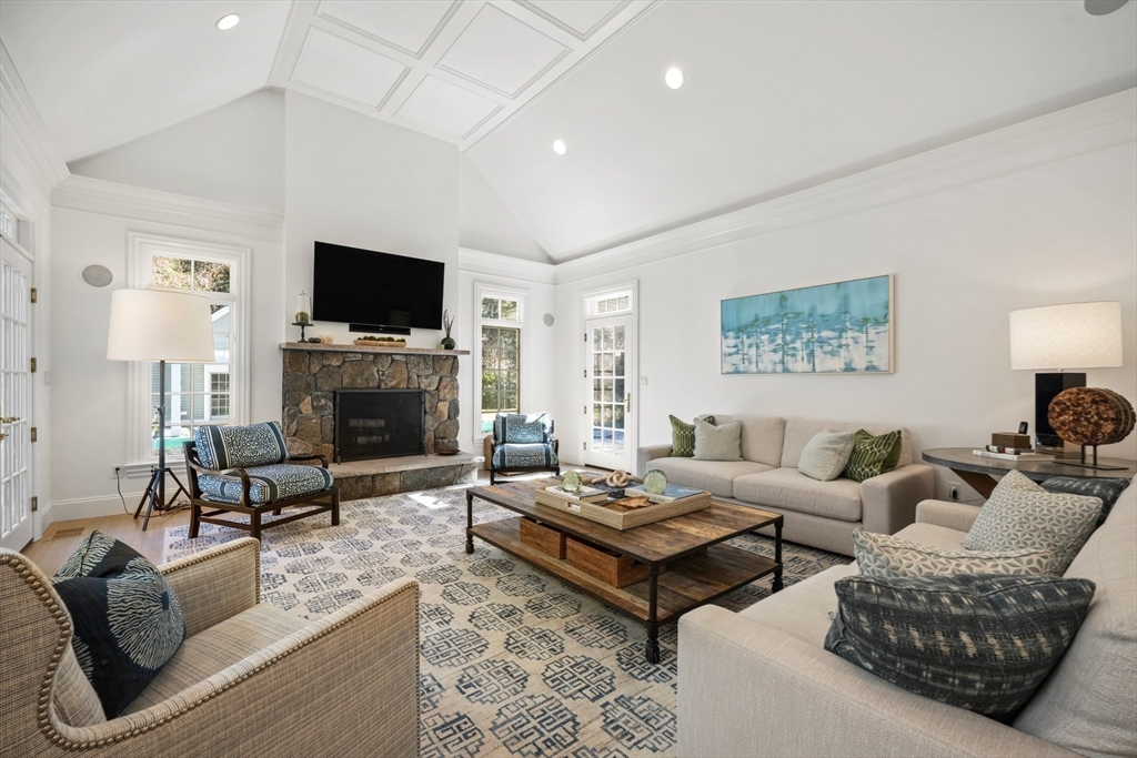 1 Myles Standish Road Weston, MA 02493 - Photo 13 of 40 a living room with furniture a flat screen tv and a fireplace