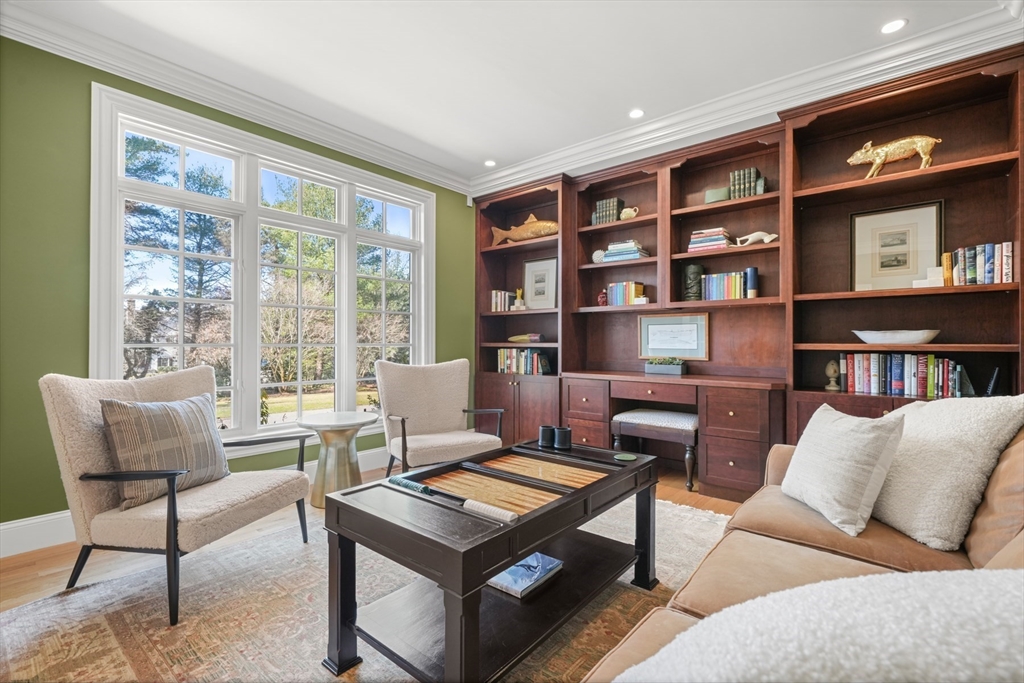 1 Myles Standish Road Weston, MA 02493 - Photo 14 of 40 a living room with furniture and a book shelf