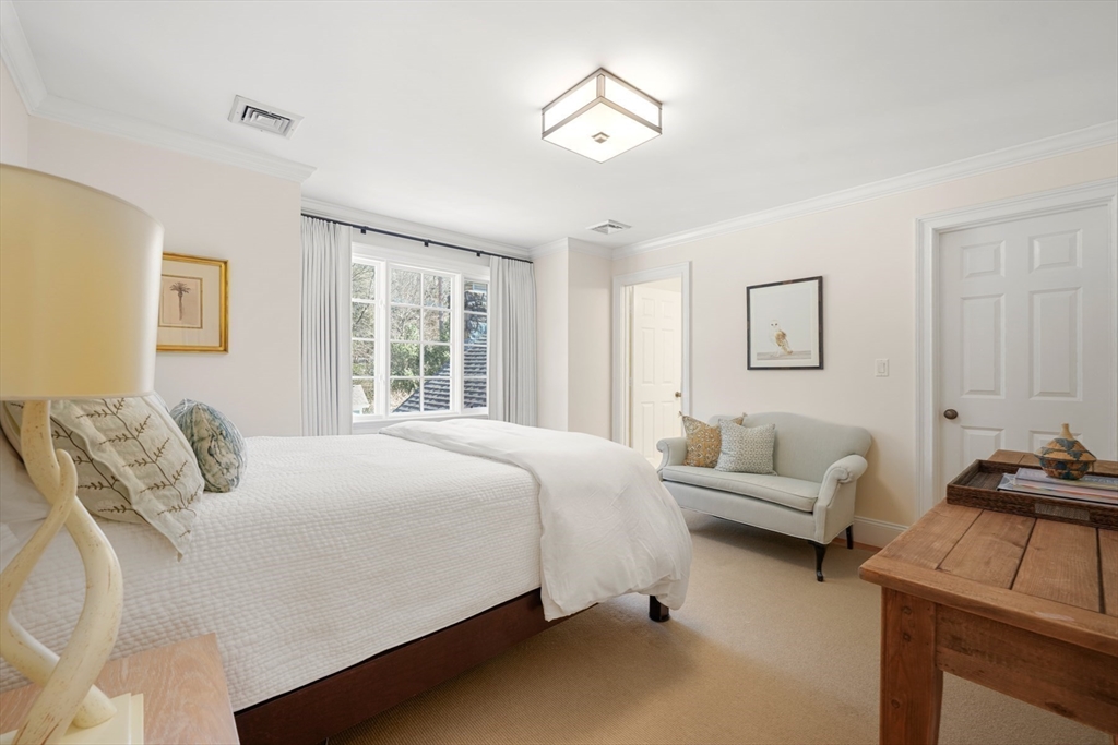 1 Myles Standish Road Weston, MA 02493 - Photo 20 of 40 a bedroom with a bed and a couch