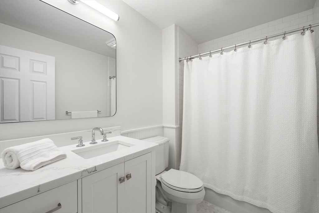 1 Myles Standish Road Weston, MA 02493 - Photo 21 of 40 a bathroom with a sink and a mirror
