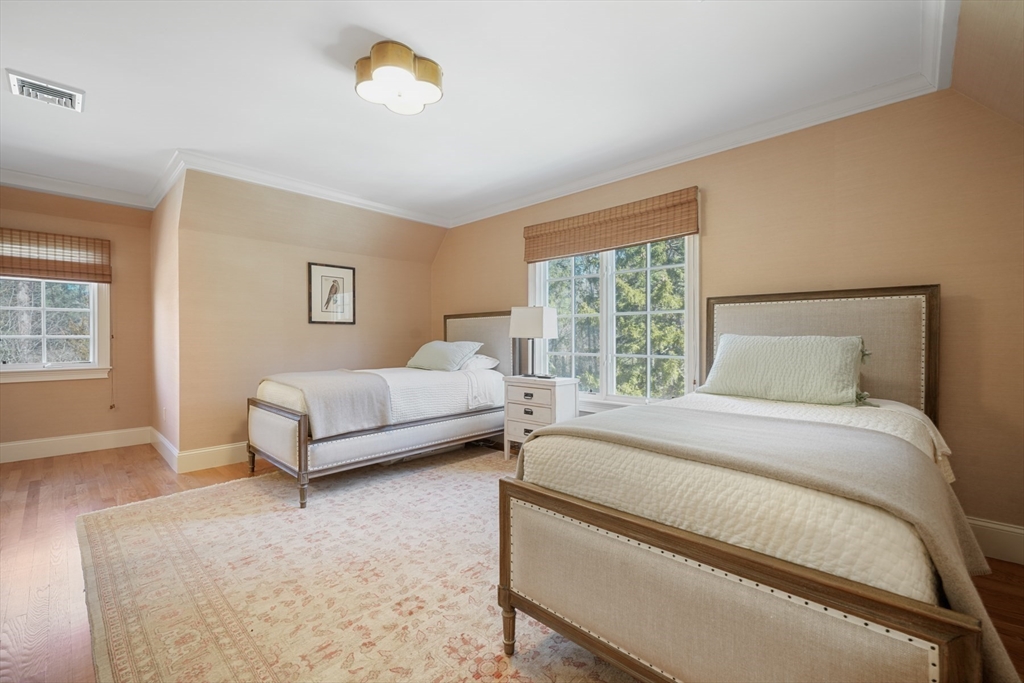 1 Myles Standish Road Weston, MA 02493 - Photo 22 of 40 a bedroom with a bed and a window
