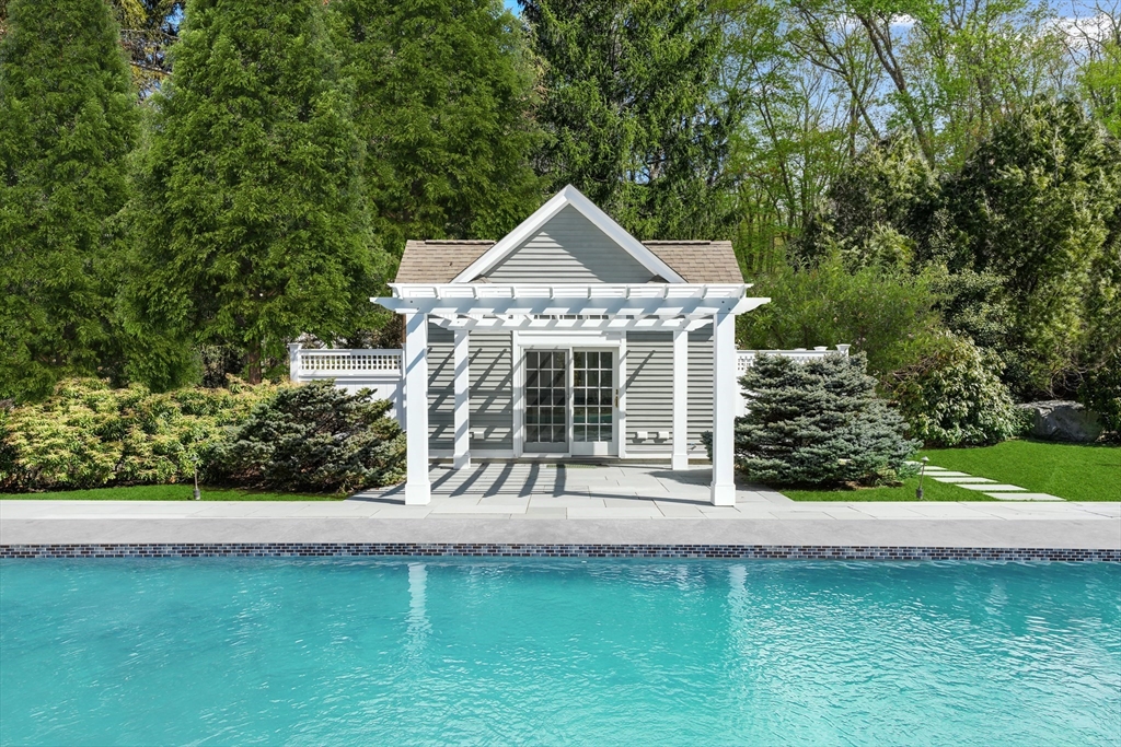 1 Myles Standish Road Weston, MA 02493 - Photo 35 of 40 a front view of a house with a yard