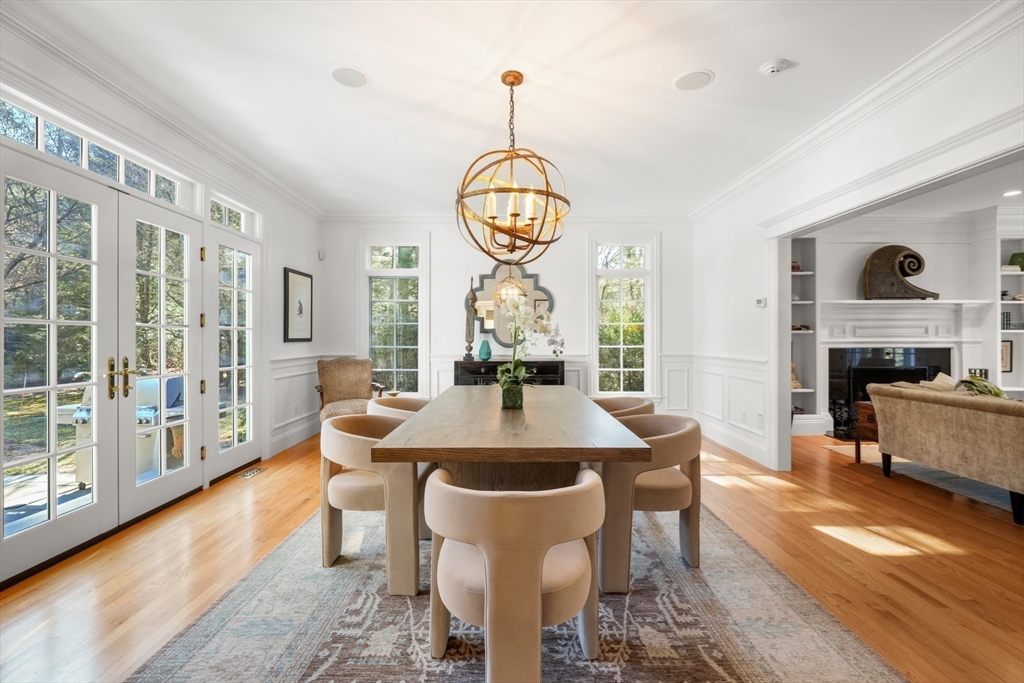 1 Myles Standish Road Weston, MA 02493 - Photo 5 of 40 a dining room with furniture a chandelier and wooden floor