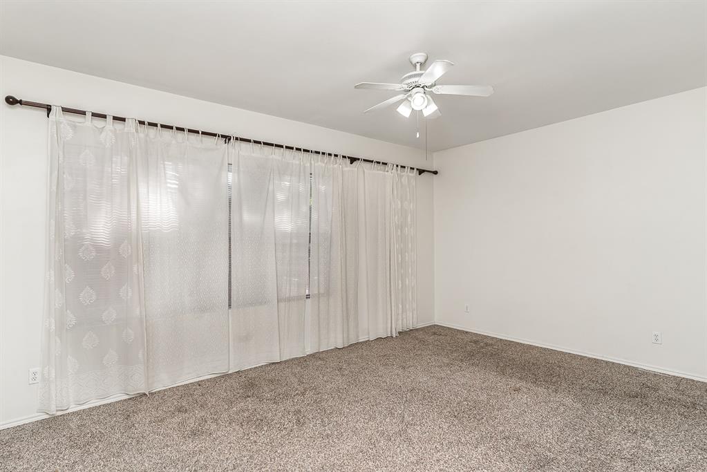 3329 Rosedale Avenue, Unit 21 University Park, TX 75205 - Photo 12 of 24 Spare room with ceiling fan and carpet floors
