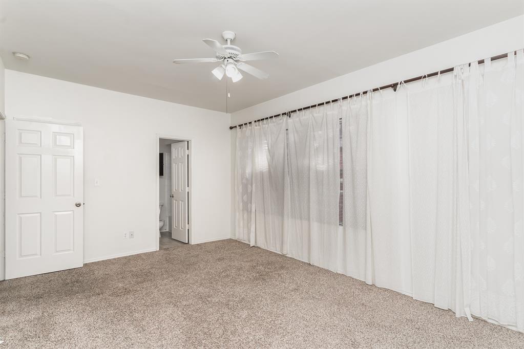 3329 Rosedale Avenue, Unit 21 University Park, TX 75205 - Photo 13 of 24 Carpeted spare room featuring ceiling fan and baseboards