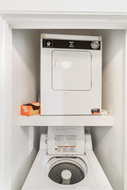 3329 Rosedale Avenue, Unit 21 University Park, TX 75205 - Photo 15 of 24 Washroom featuring stacked washer / drying machine