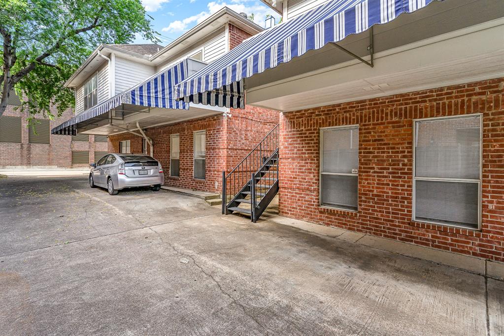 3329 Rosedale Avenue, Unit 21 University Park, TX 75205 - Photo 22 of 24 View of property exterior with stairs and brick siding