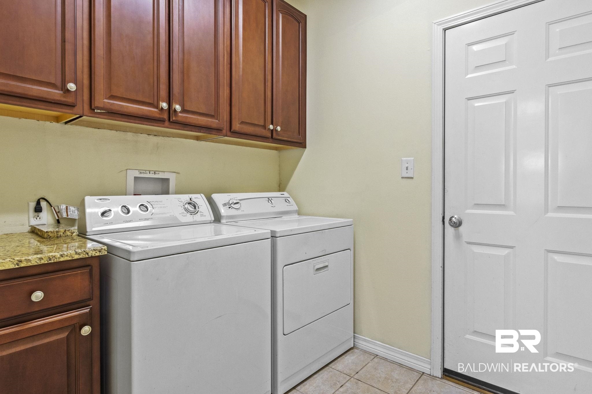 166 Club Drive Fairhope, AL 36532 - Photo 32 of 41 Laundry area featuring separate washer and dryer, cabinets, and light tile patterned flooring