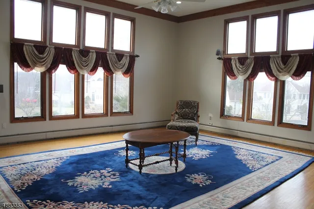 a living room with furniture and a rug