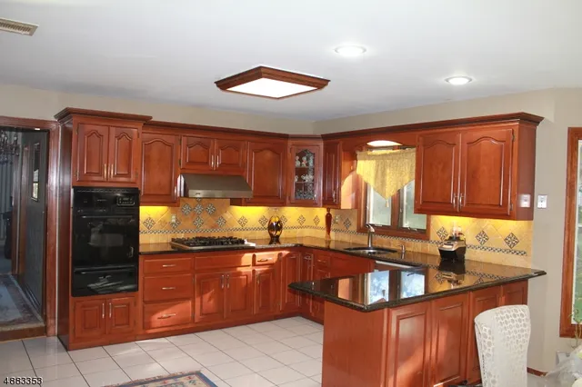 a kitchen with granite countertop a sink and counter space