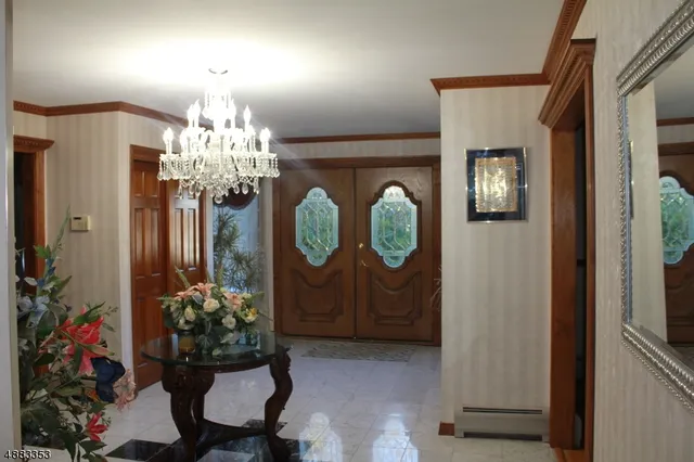 a living room with dining table and chairs