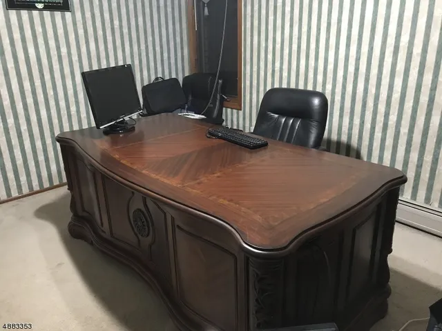 a kitchen with a table chairs and a refrigerator