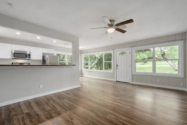 a view of a kitchen with a sink and a window
